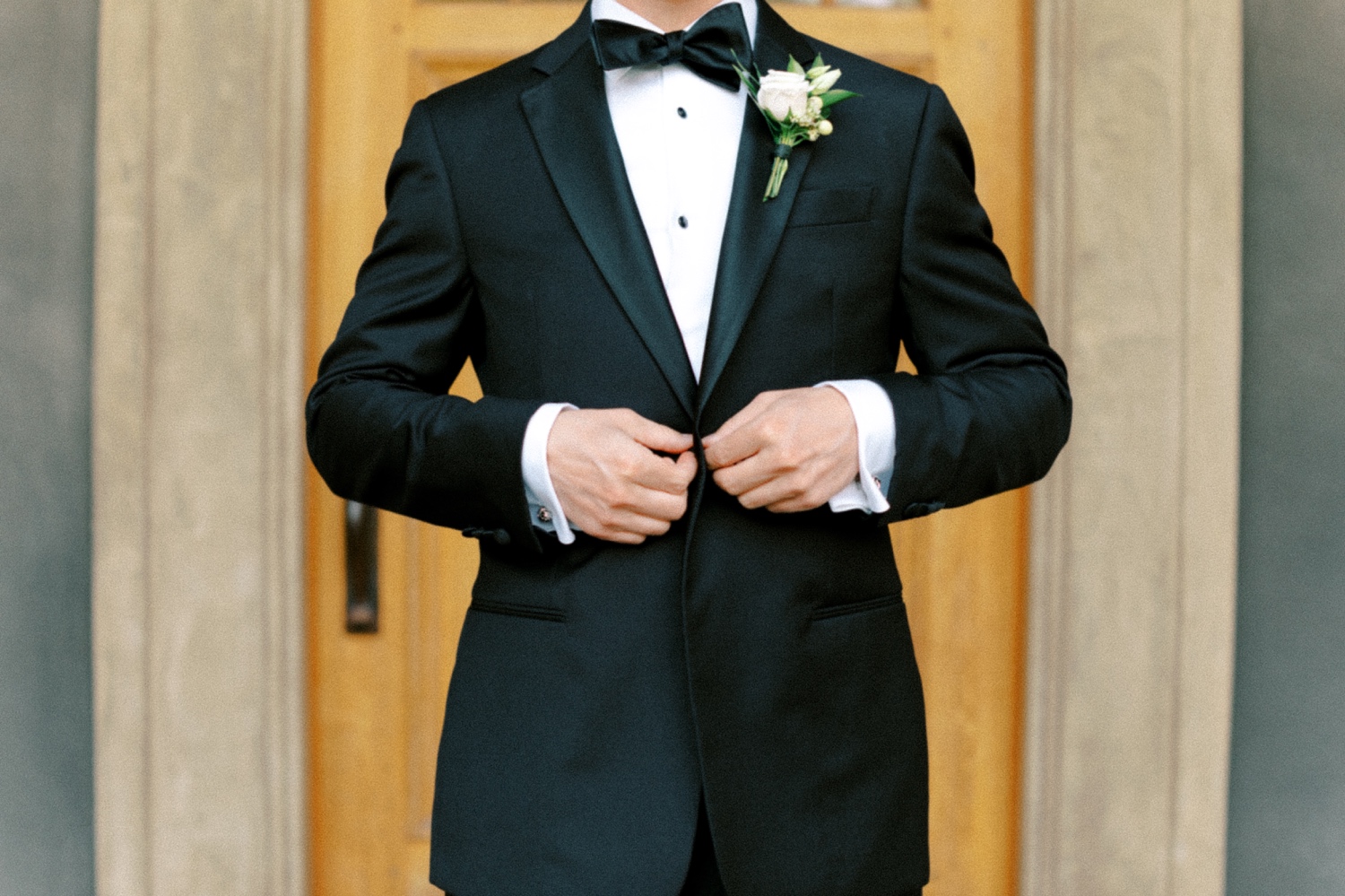 Groom adjusting tux for Abeja Winery and Inn Wedding