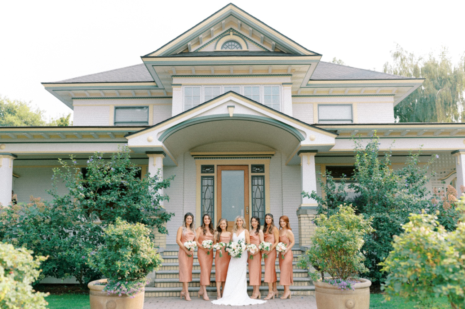 Abeja Winery and Inn Wedding bridesmaids in front of farmhouse