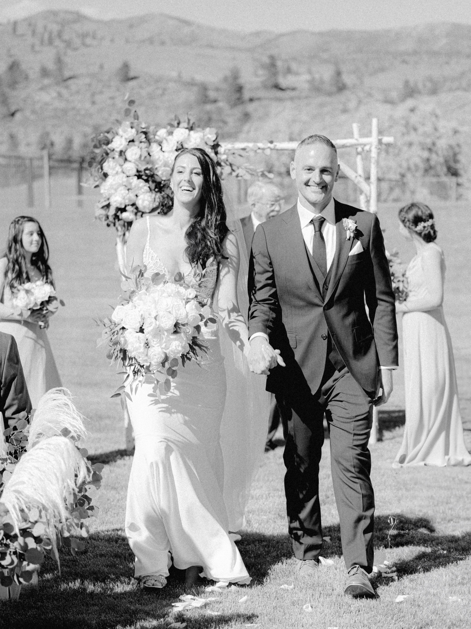 bride and groom walk down the aisle at harmony meadows