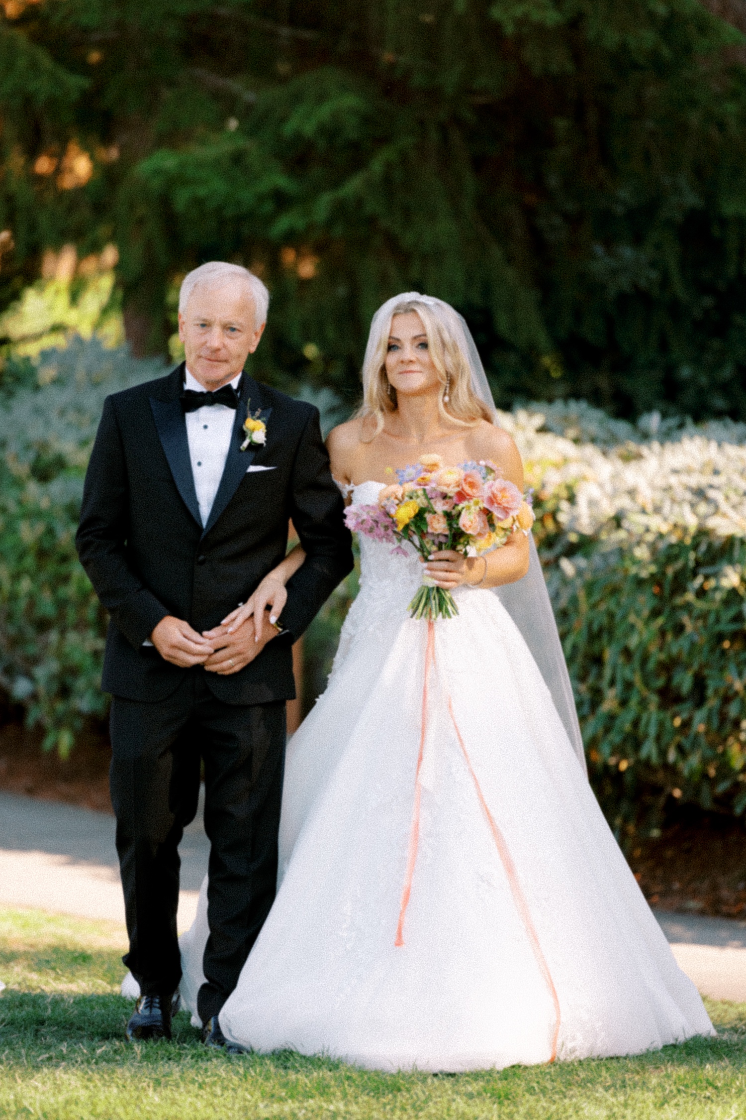 Bride walking down the aisle with her father for Ceremony flowers by Leah Erickson Floral for Alderbrook Resort Wedding Ceremony