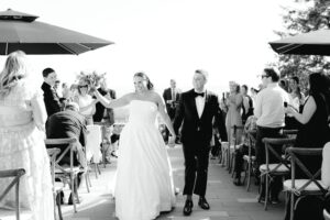 Bride and groom walking down the aisle from their ceremony at Amaterra Winery