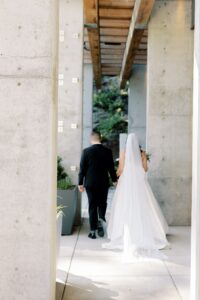 Bride and groom walking leaving their ceremony at Amaterra Winery