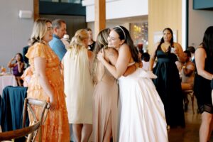 Bride and groom hugging guests at Amaterra Winery Wedding