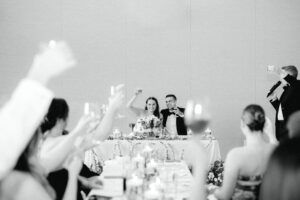 Guests cheering for wedding reception toasts at Amaterra Winery