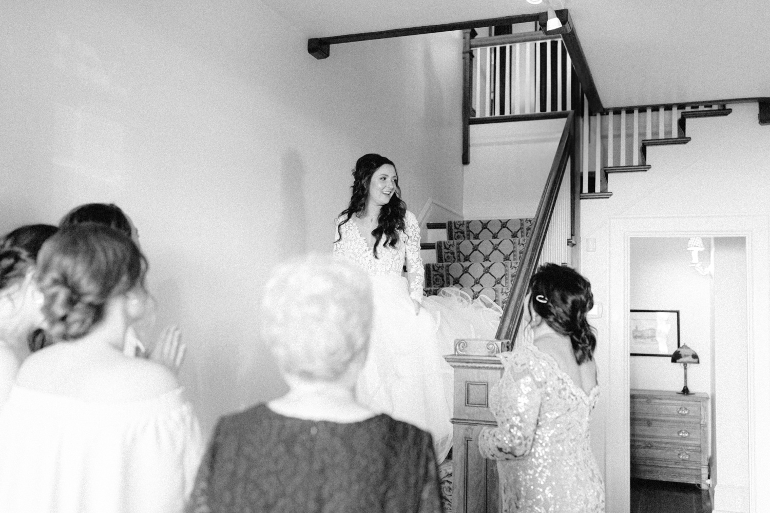 Bride walking down stairs at Abeja Winery Farmhouse