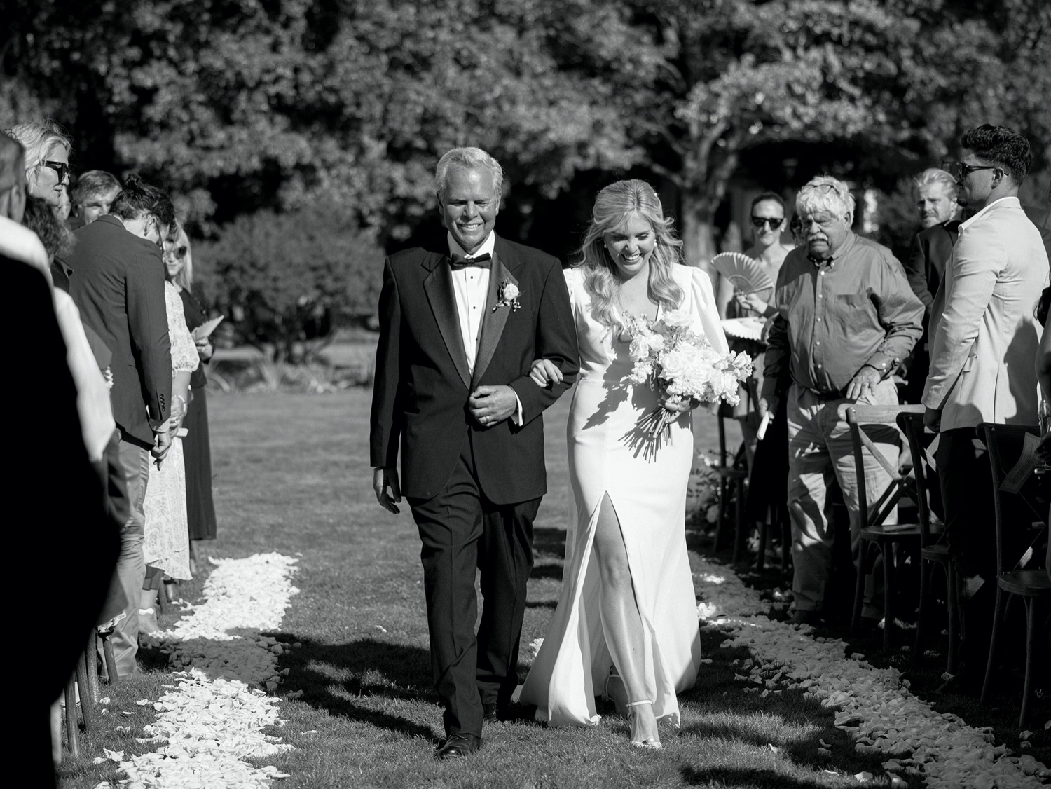 father of the bride walks the bride down the aisle at southern inspired wedding