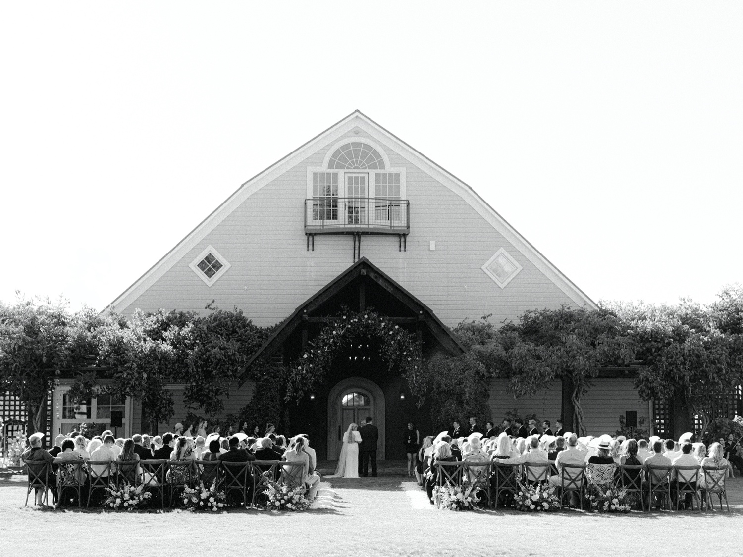 wedding ceremony in front of the big barn at abeja winery and inn