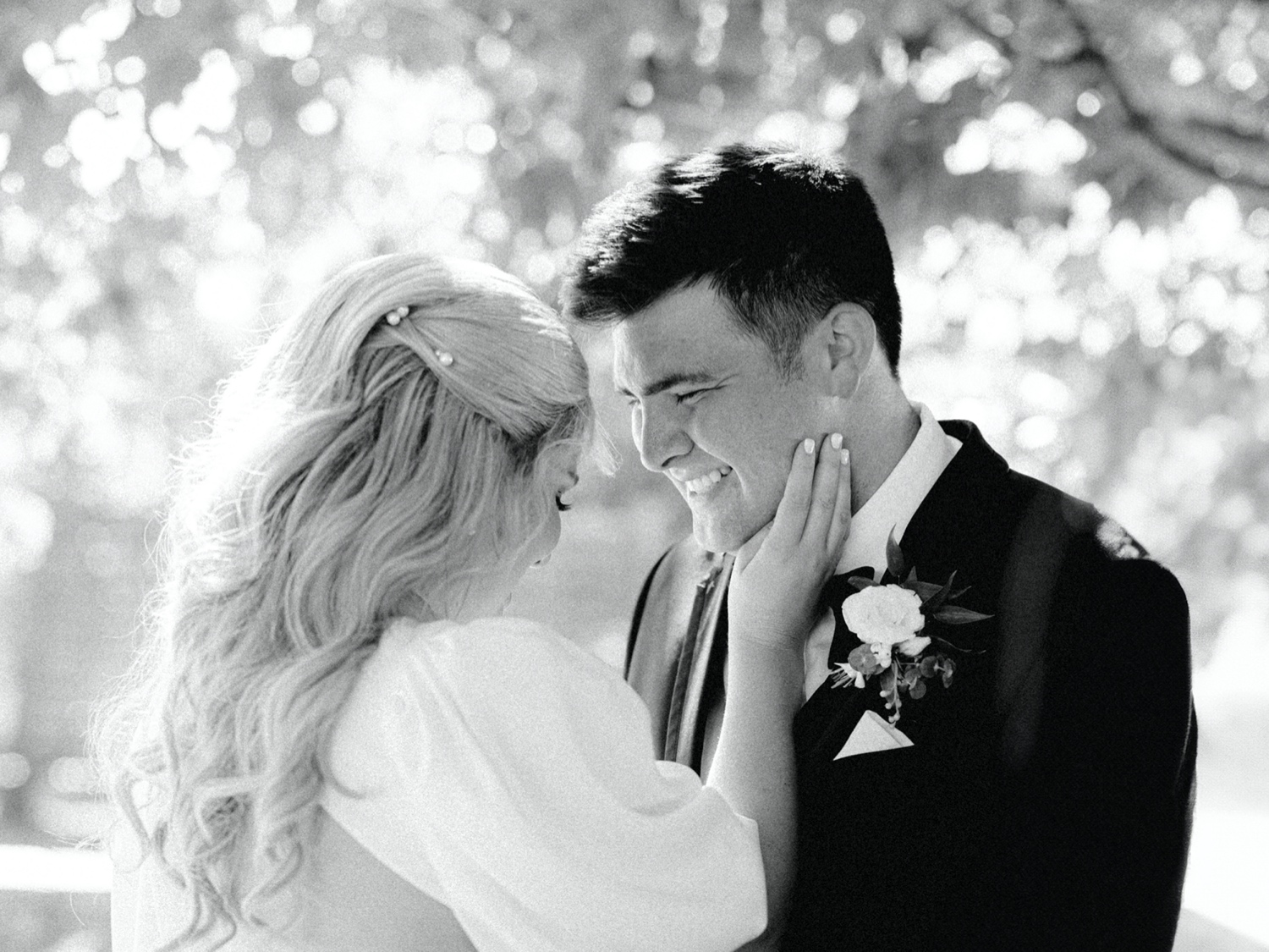 bride and groom laugh and share intimate moment during couple portraits at abeja winery