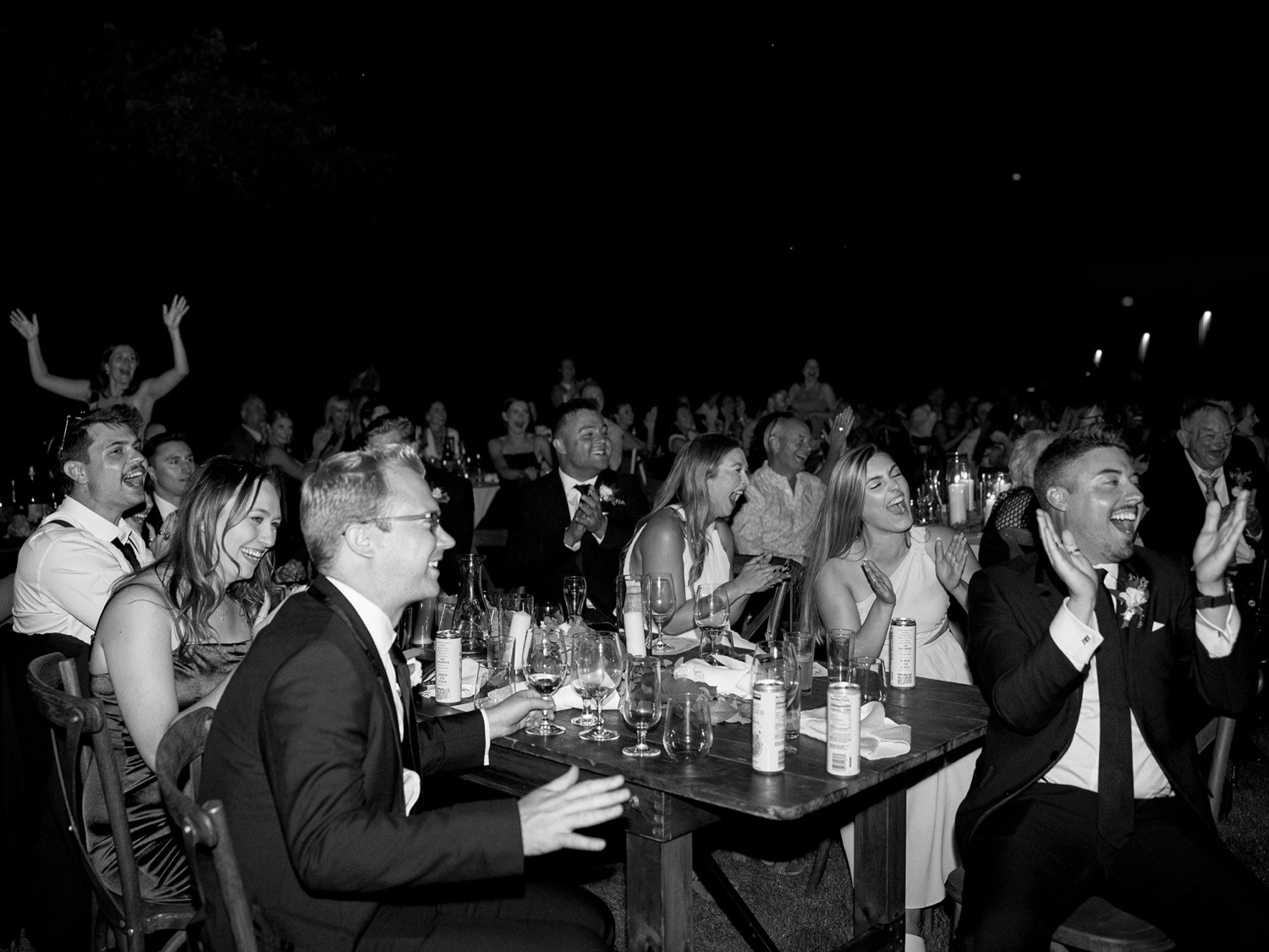 guests cheering and laughing during wedding toasts at abeja winery wedding
