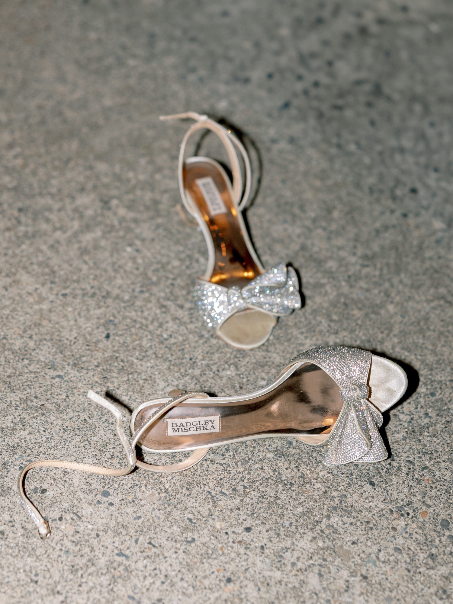 bridal shoes on the floor during wedding reception at abeja winery