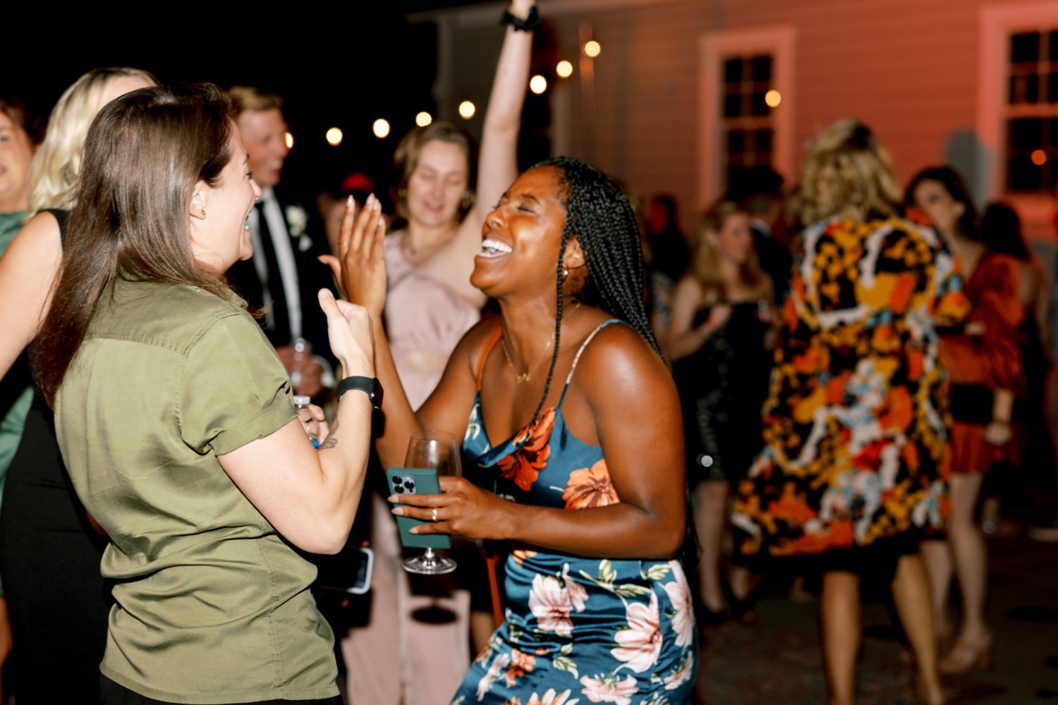 guests laughing on the dance floor during southern inspired wedding at abeja winery
