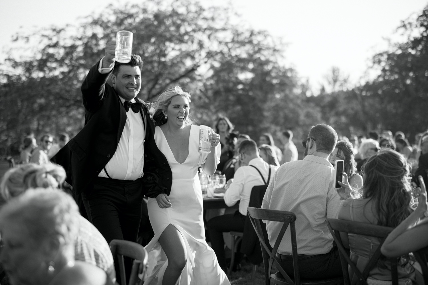 bride and groom celebrate entering wedding reception for southern wedding at abeja winery