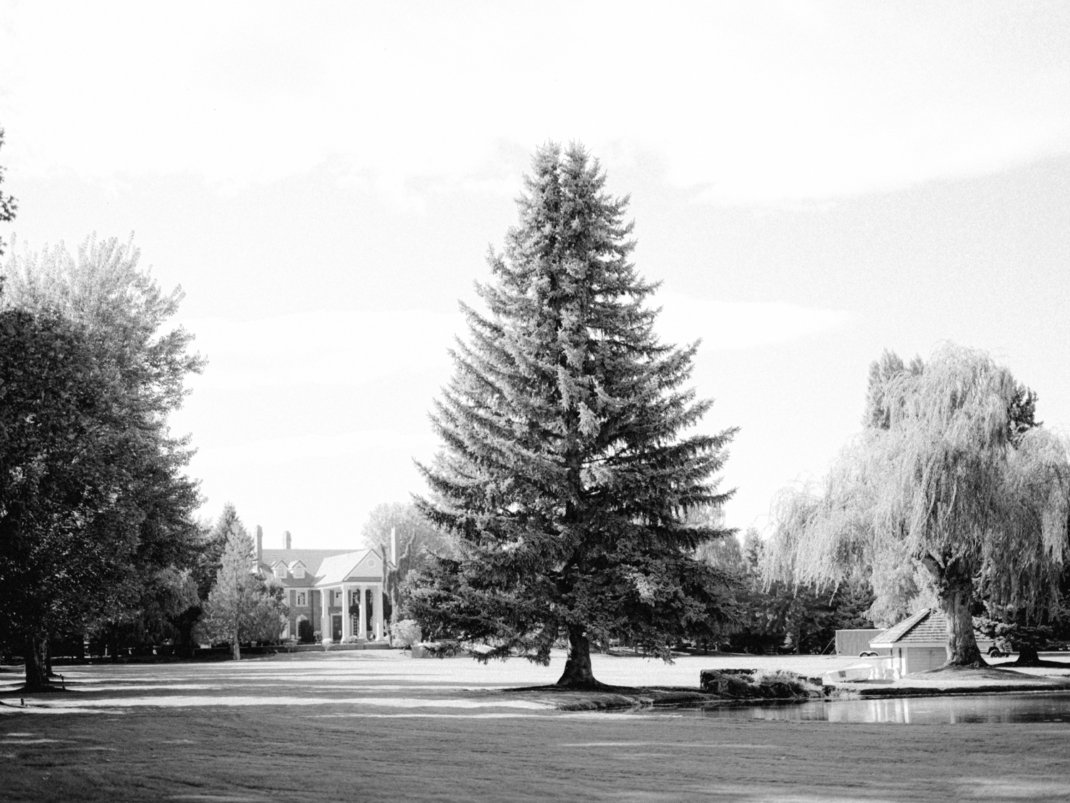 black and white landscape shot of front property at oakshire estate and airfield 